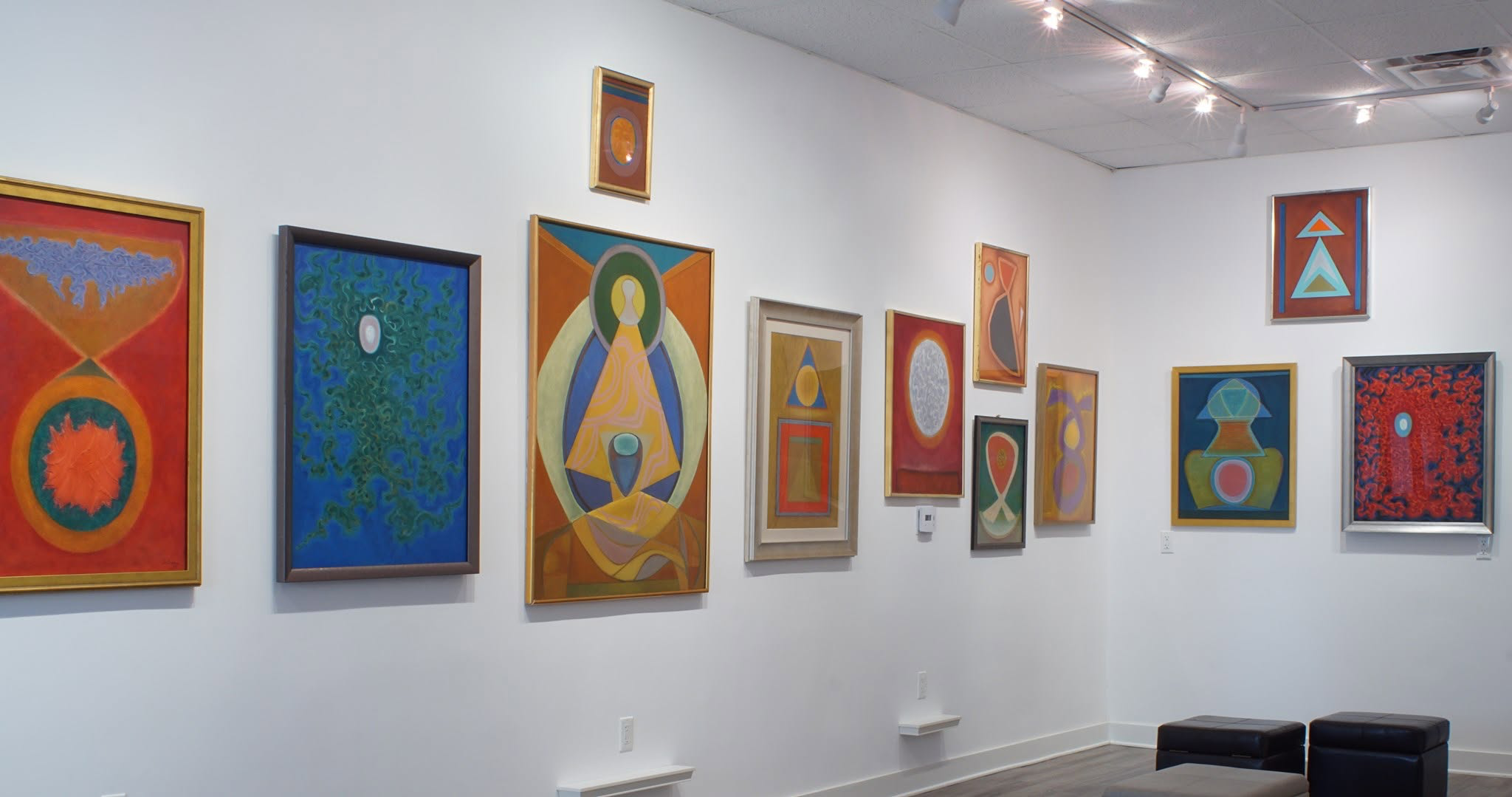 Benjamin Creme paintings on a museum wall, including Vision